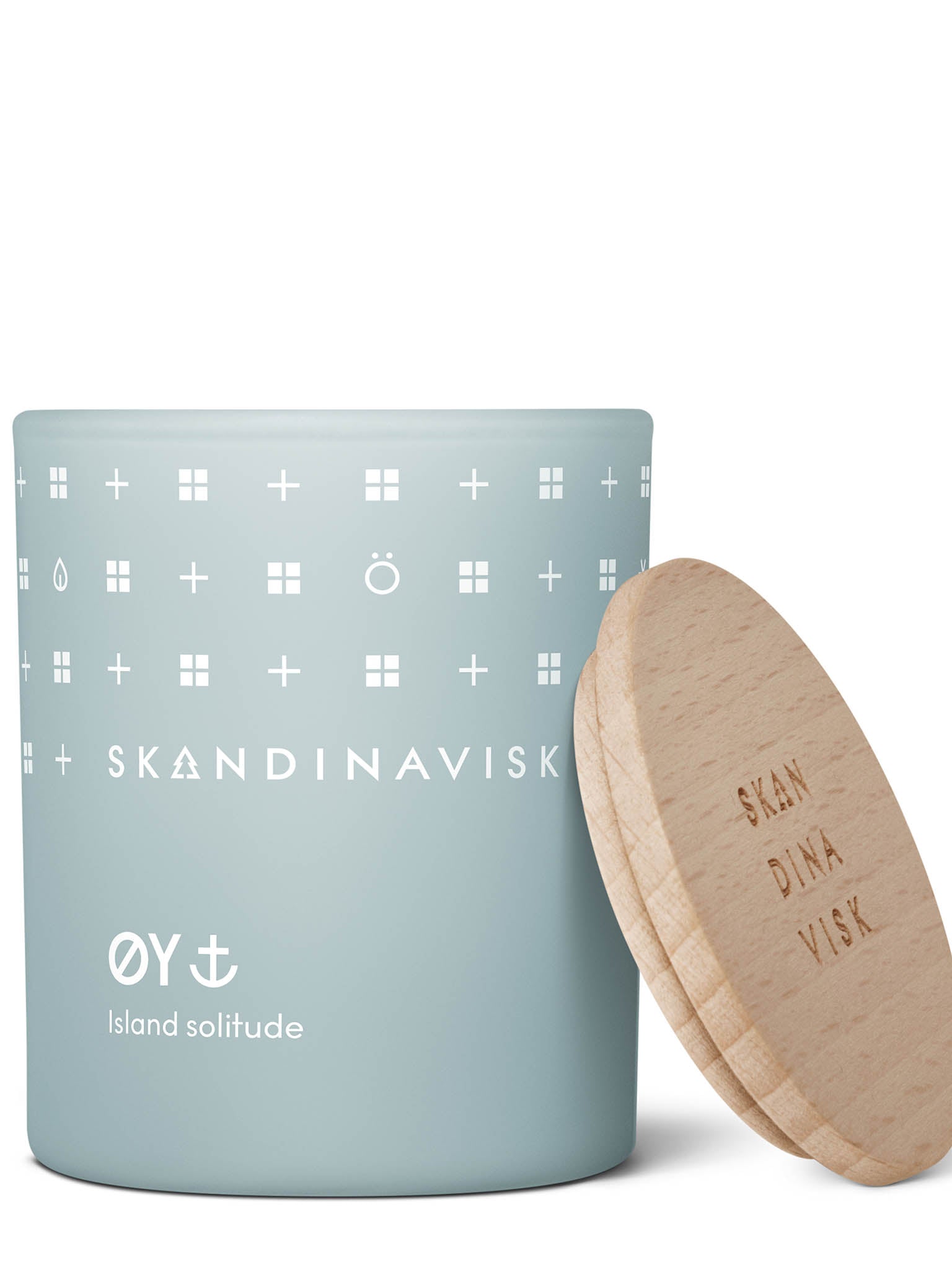 Duftlys i blå glasskrukke med logo og ØY Island solitude, lokk ved siden