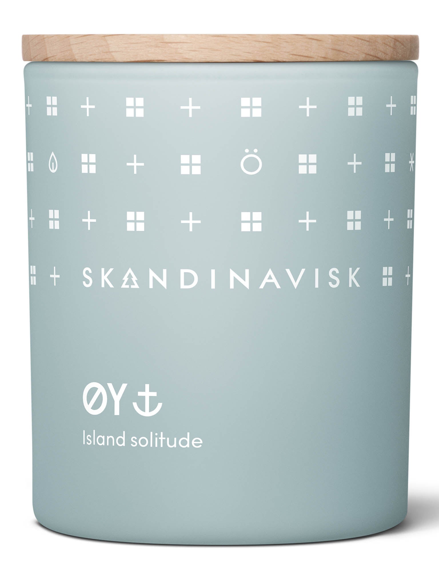Duftlys i blå glasskrukke med brennende veke og dekorert mønster