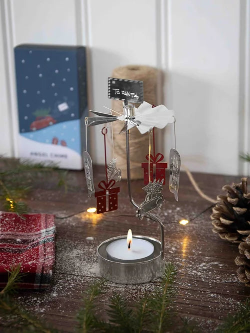 Telys-rotator til Santa i metall over telys med flamme
